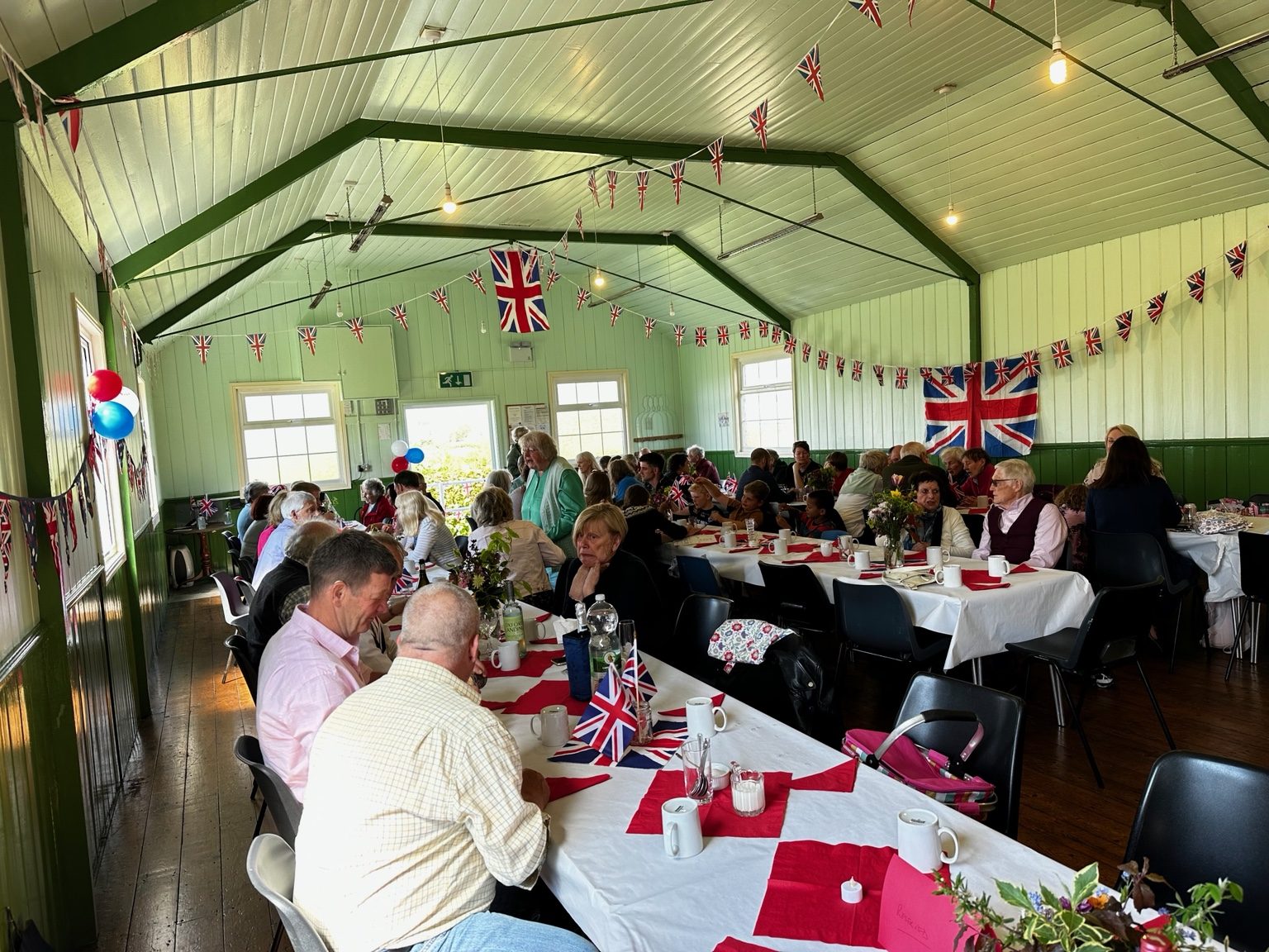 Busy community event inside Musgrave Parish Institute